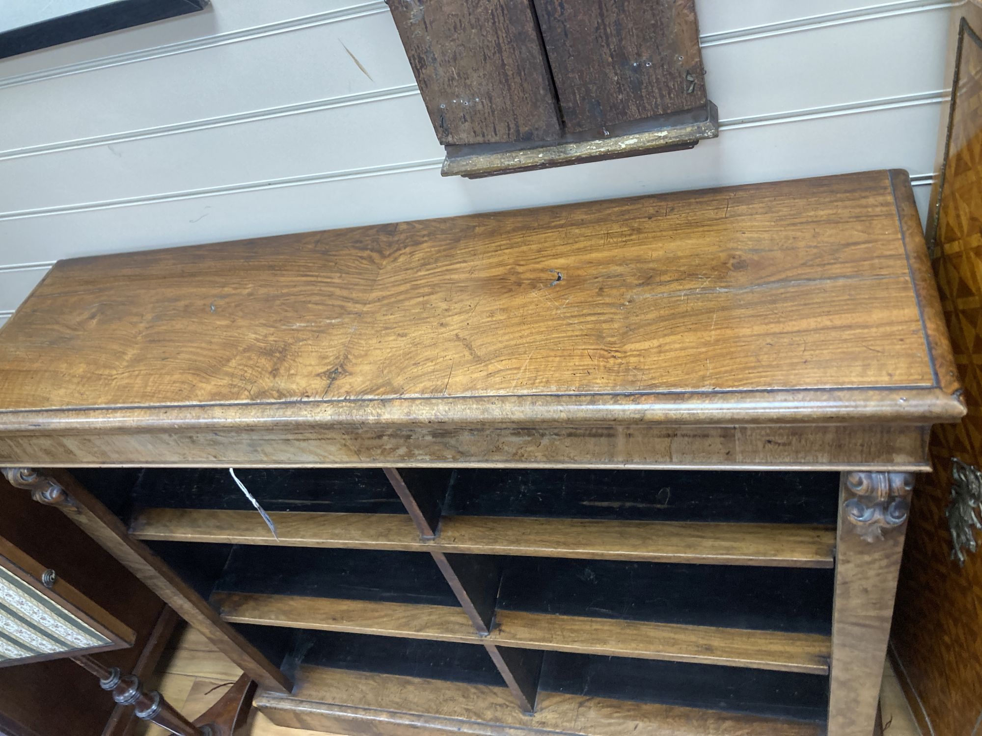 A Victorian walnut open bookcase, length 121cm, depth 34cm, height 107cm